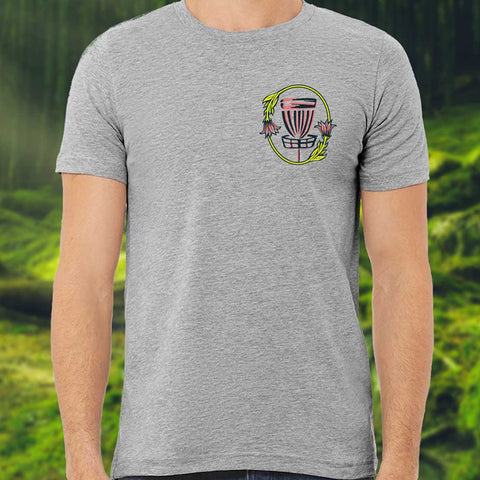 gray short sleeved shirt with a women creating life from a disc golf basket